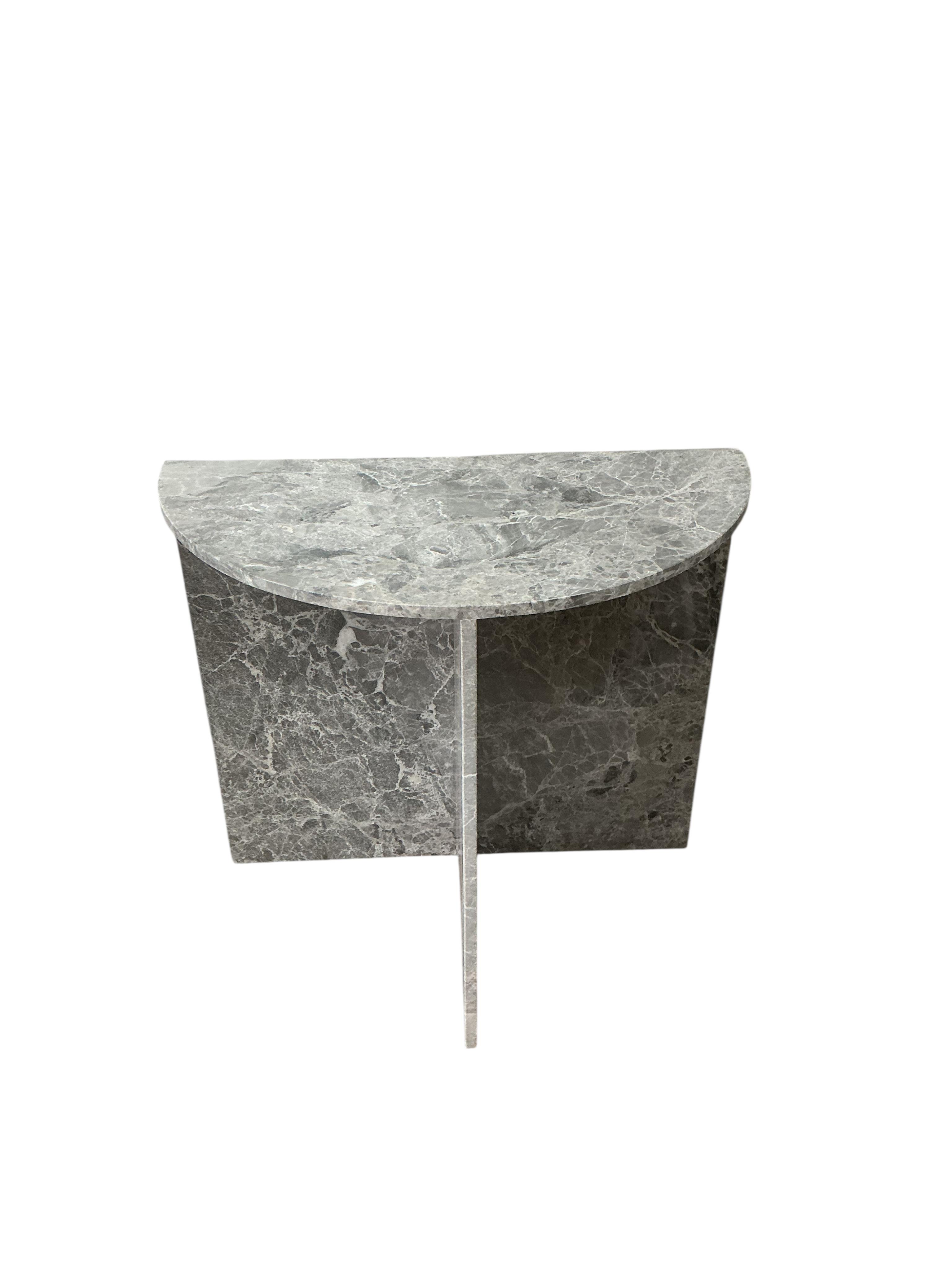 A near pair of reconstituted marble demi lune console tables, width 80cm, depth 42cm, height 75cm